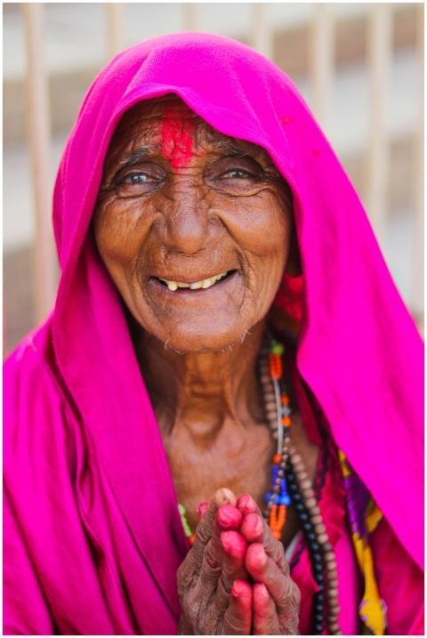 Senior woman in vibrant pink traditional attire sm