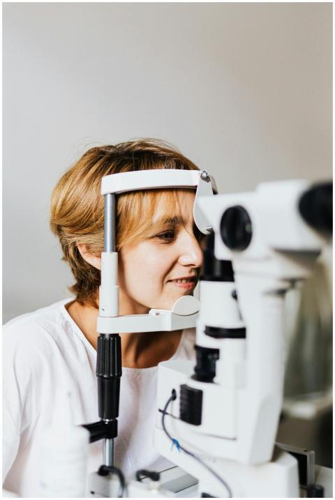 A woman experiencing an eye examination using mode