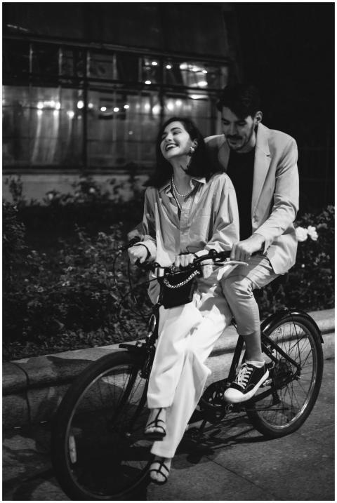 Happy couple enjoying a romantic bicycle ride toge