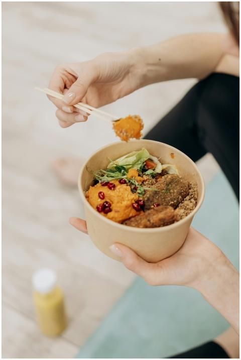 A close-up of a person enjoying a healthy meal wit