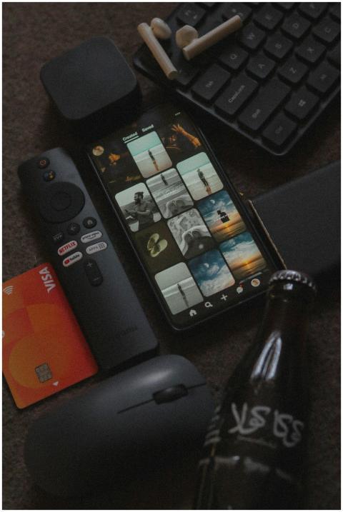 Close-up of gadgets on a desk including smartphone