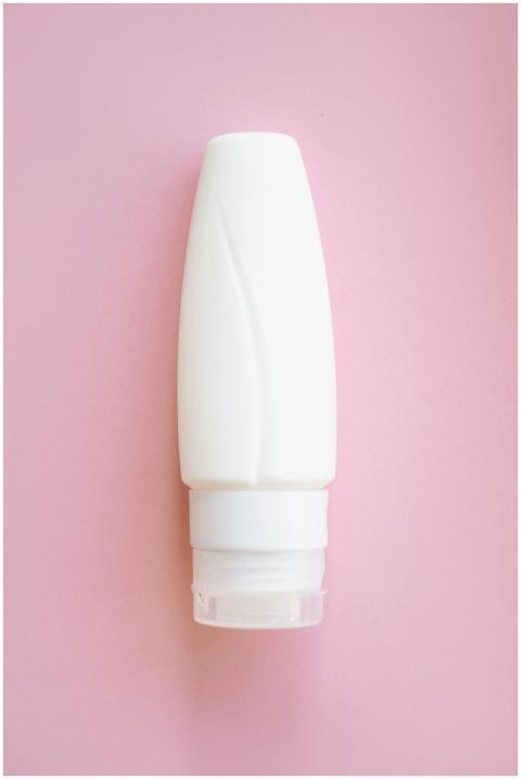 Simple and elegant white cosmetic bottle displayed