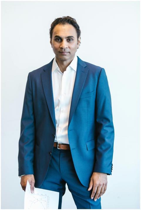 Portrait of a confident businessman holding papers