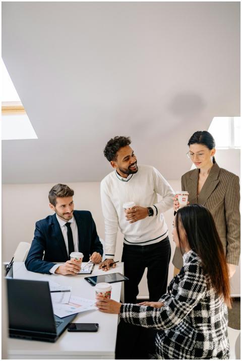 A diverse group of colleagues having a coffee brea