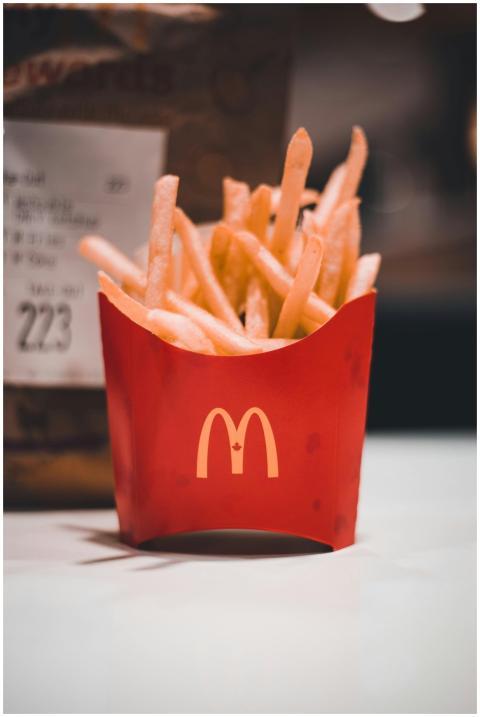 Golden crispy McDonald's french fries in iconic re