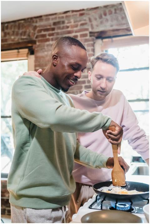 A warm, intimate scene of a couple cooking togethe