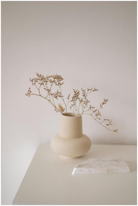 Elegantly arranged dried flowers in a ceramic vase