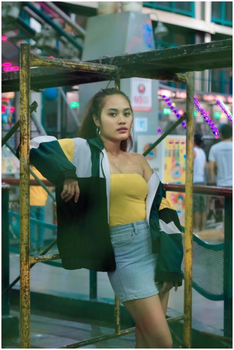 Fashionable woman posing outdoors in an urban sett