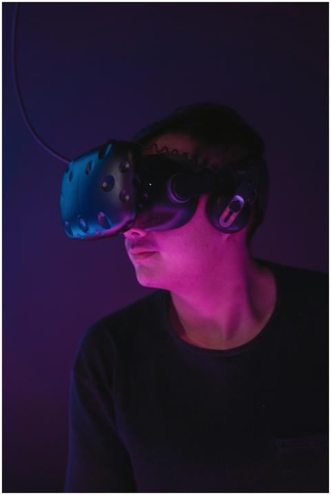 A man experiencing virtual reality wearing a VR he
