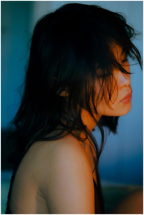 Serene side profile portrait of an Asian woman wit