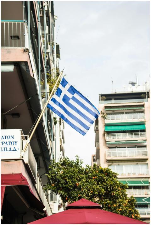 Greek flag in Thessaloniki, Greece, with apartment