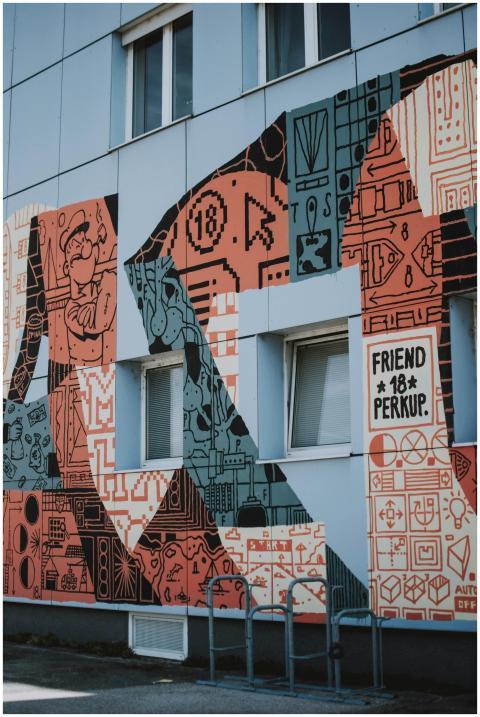 Colorful graffiti art decorates an urban building