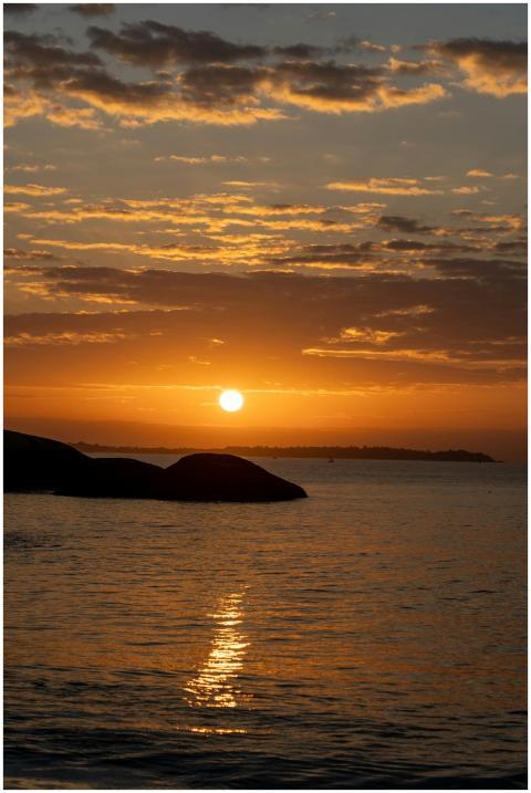 A mesmerizing sunset over the ocean with vibrant o