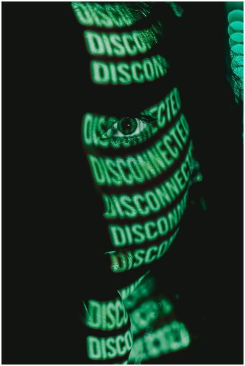 Close-up portrait featuring green digital text pro