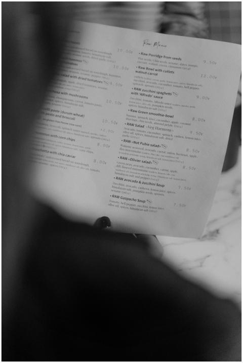Grayscale photo showing a close-up of a restaurant