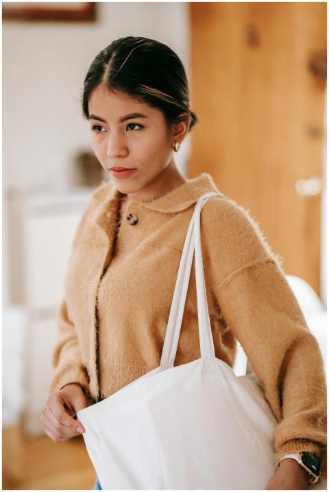 Young woman holding a sustainable cotton shopping