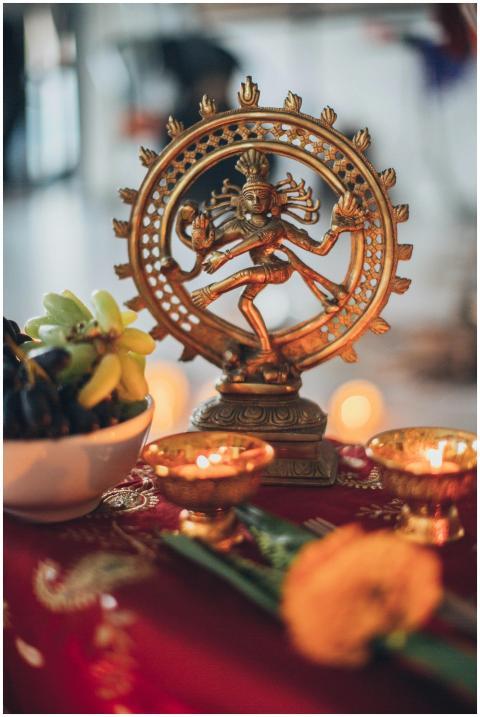 Intricate Shiva Nataraja statue surrounded by trad