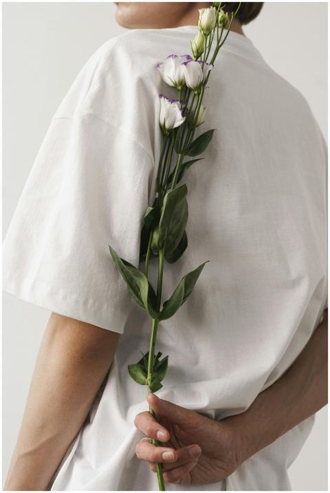 A minimalist portrait featuring a person in a whit