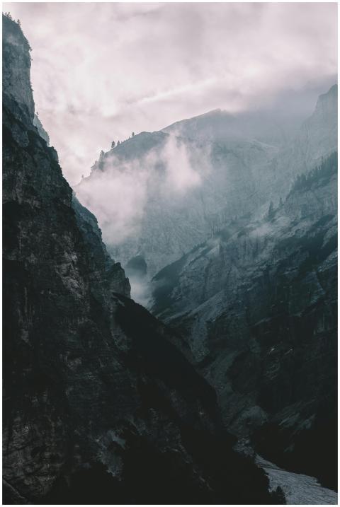 Misty and dramatic mountain landscape enveloped in