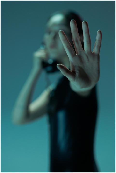 A close-up shot of a woman's hand with futuristic,