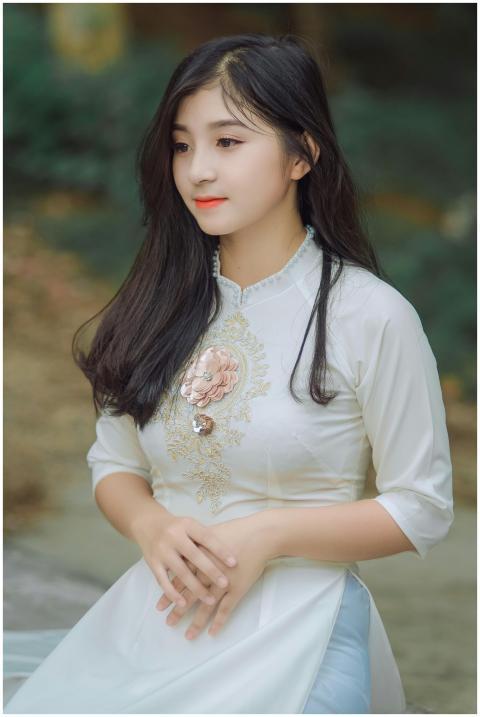 Beautiful young woman in a traditional dress posin