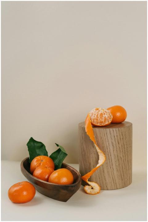 Aesthetic composition of fresh tangerines with lea