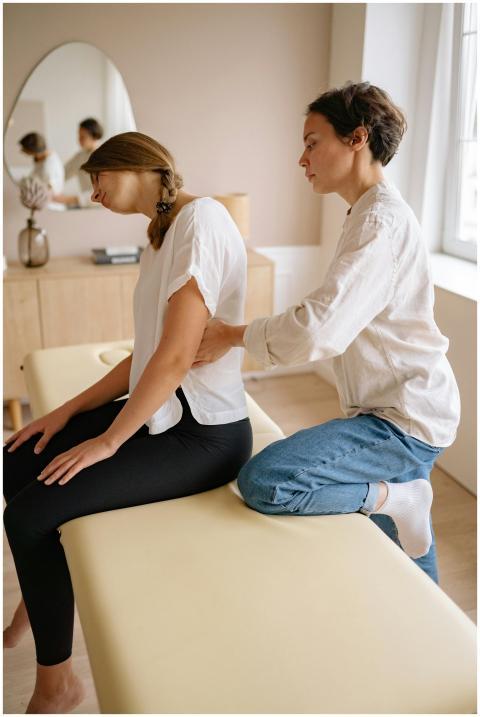 Chiropractor giving a spinal adjustment to a femal