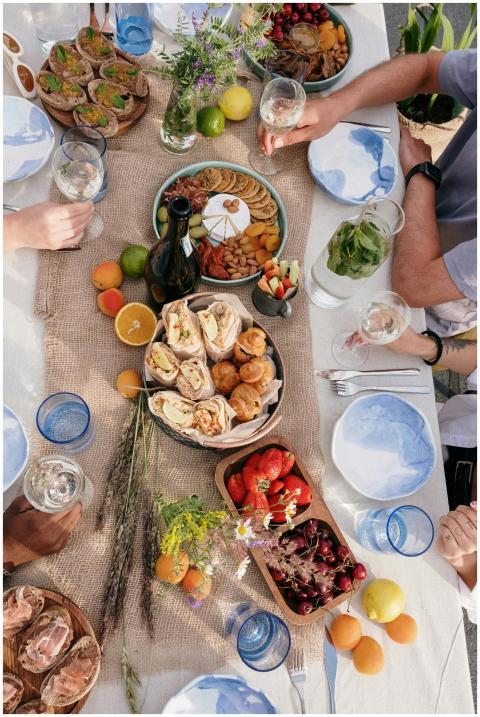 Top view of a lively outdoor brunch with friends,
