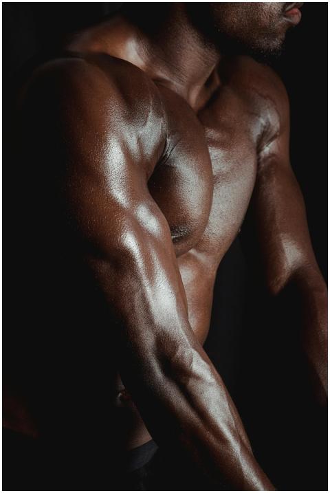 Detailed close-up of muscular man showcasing defin