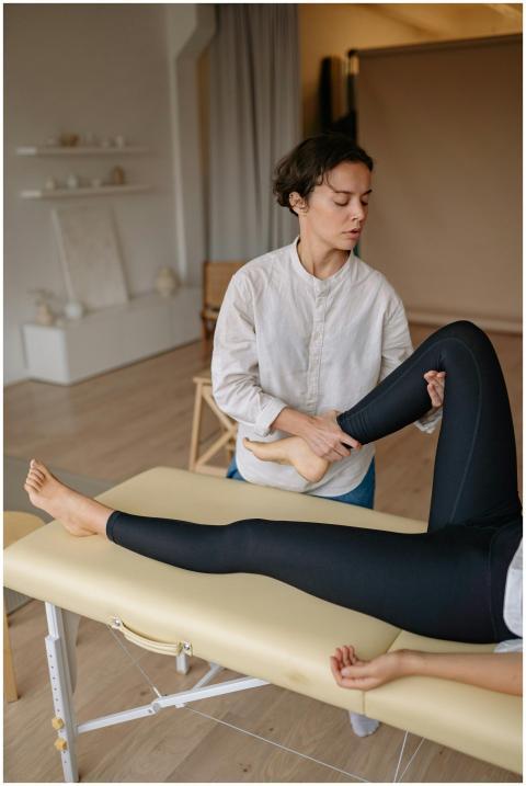 Woman receiving a leg massage in a serene spa envi