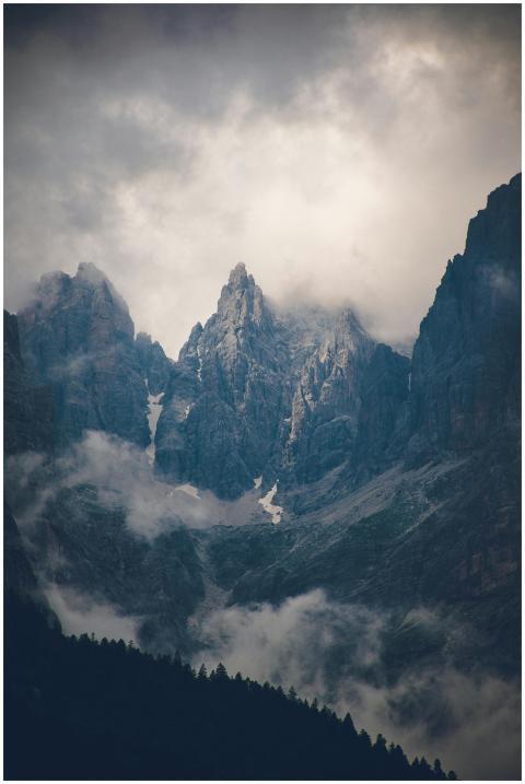 Scenic view of dramatic mountain peaks shrouded in