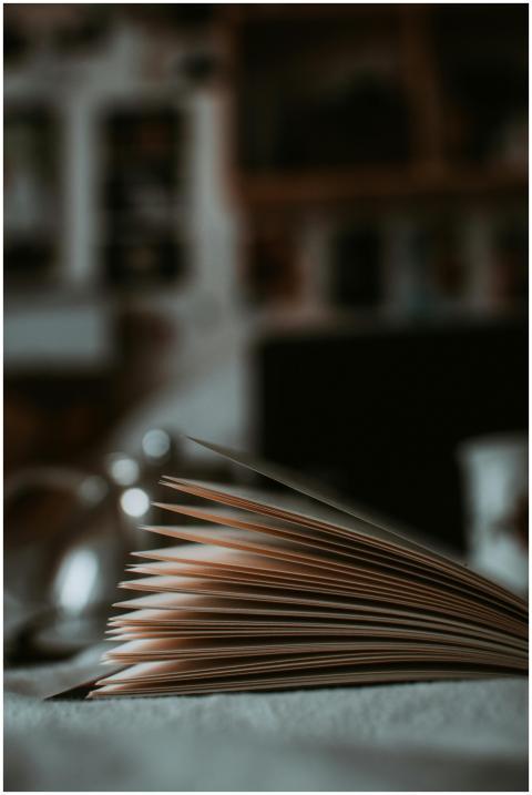 Artistic shot of an open book with a focus on page