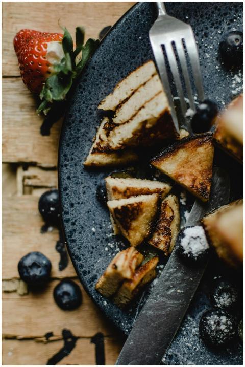 Delicious stack of pancakes served with fresh berr