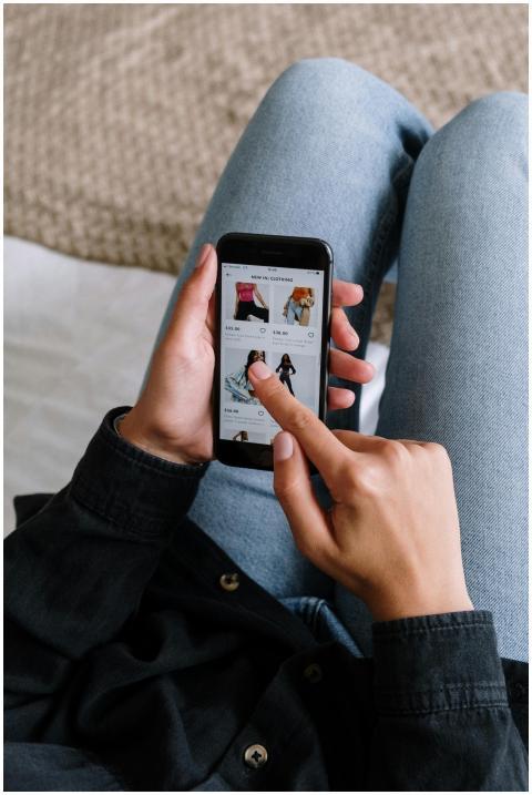 Close-up of a woman shopping online on a smartphon