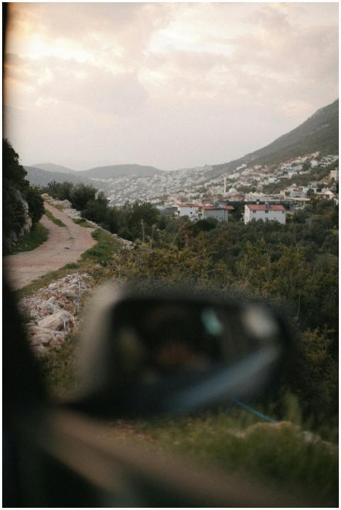 Capture of a rural town with tree-lined roads, mou