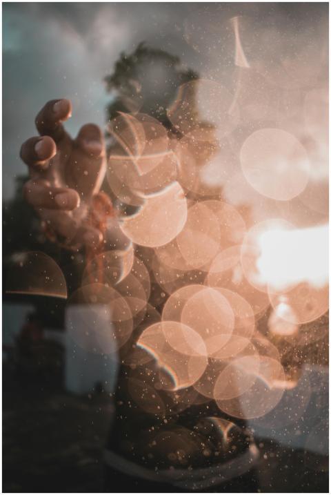 Mystical abstract image featuring hand silhouette