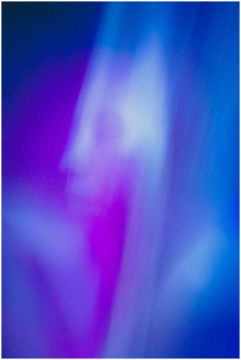 Blurred, abstract image with ethereal blue and pur