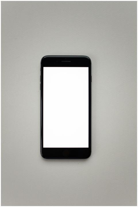 Top view of a minimalist smartphone mockup on a ne