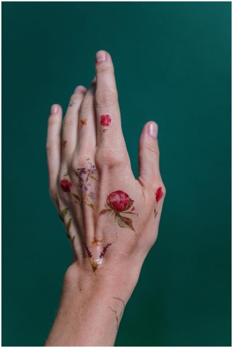 Close-up of a hand with delicate floral temporary