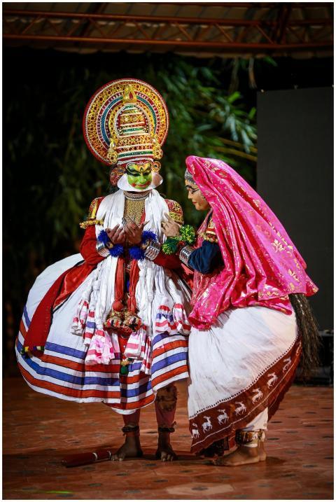 Vibrant Kathakali dancers in traditional attire pe