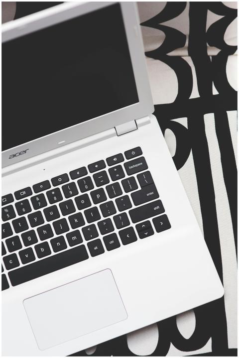 Stylish Acer laptop on a black and white geometric