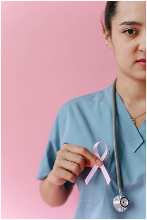 Healthcare worker in medical uniform with a pink r