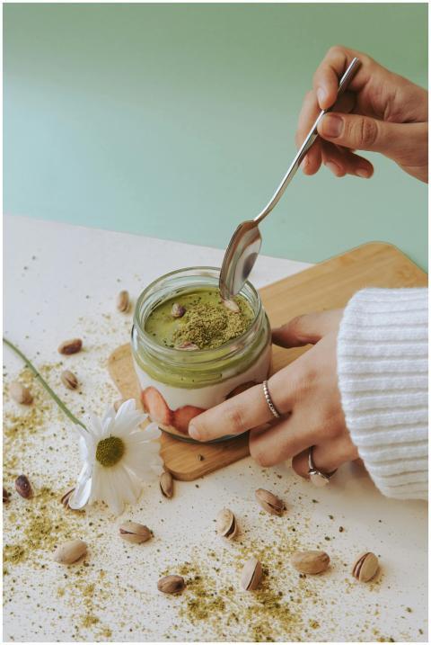 Delicious creamy matcha dessert in a jar topped wi
