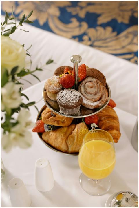 A luxurious breakfast scene with pastries and oran