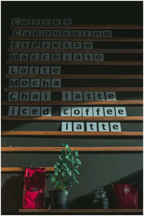 Wooden slatted coffee shop menu board indoors with