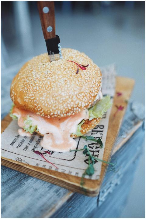 High angle of appetizing burger with meat patty sa