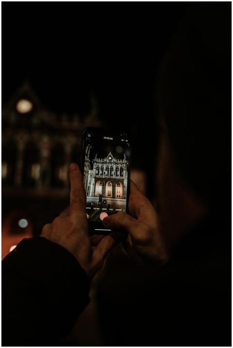 A person capturing a historic building in Erfurt,