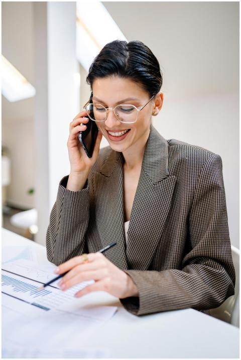 Confident businesswoman wearing glasses, talking o