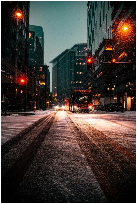 City street in Denver, CO, covered in snow at nigh
