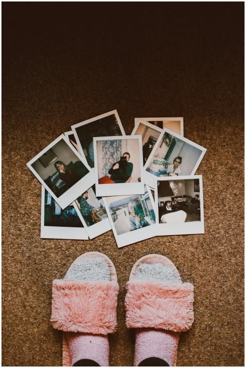 A collection of vintage Polaroids with fuzzy slipp